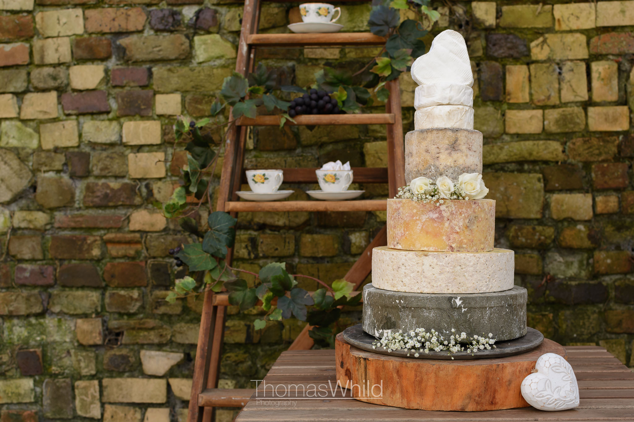 Cheese wedding cake with vintage fine china | Poole Wedding Photographer | Thomas Whild Photography