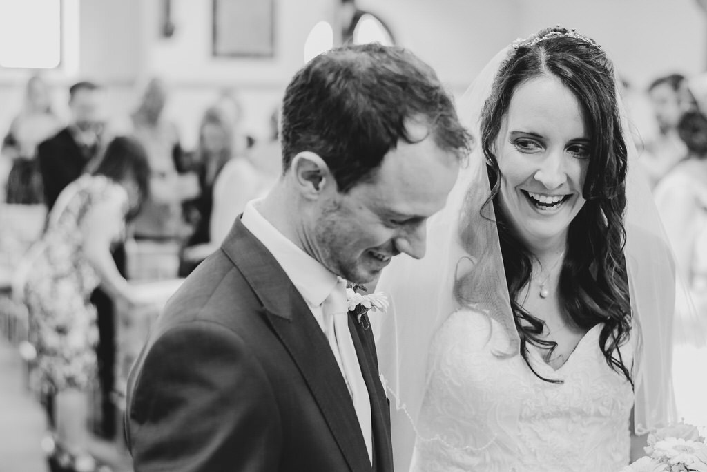 Sharing a laugh during the wedding ceremony | Dorset Wedding Photographer | Thomas Whild Photography